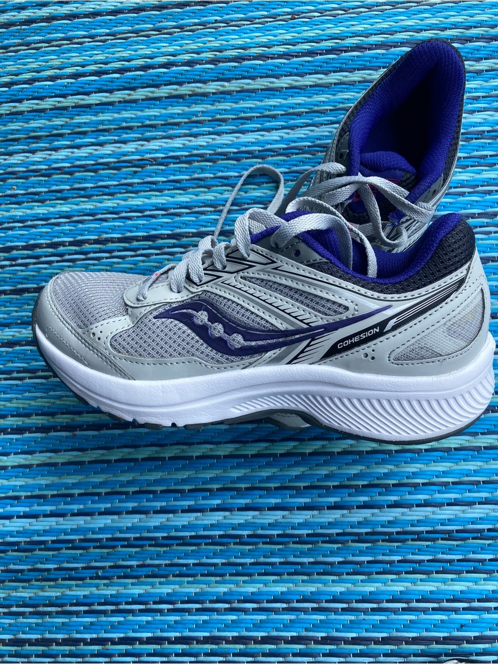 Saucony “ Cohesion” women’s Purple and White Running shoes